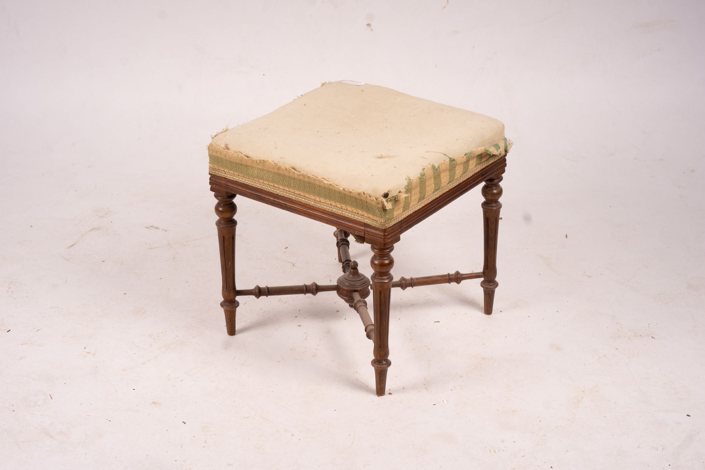 An Edwardian marquetry inlaid mahogany elbow chair and a Victorian dressing stool